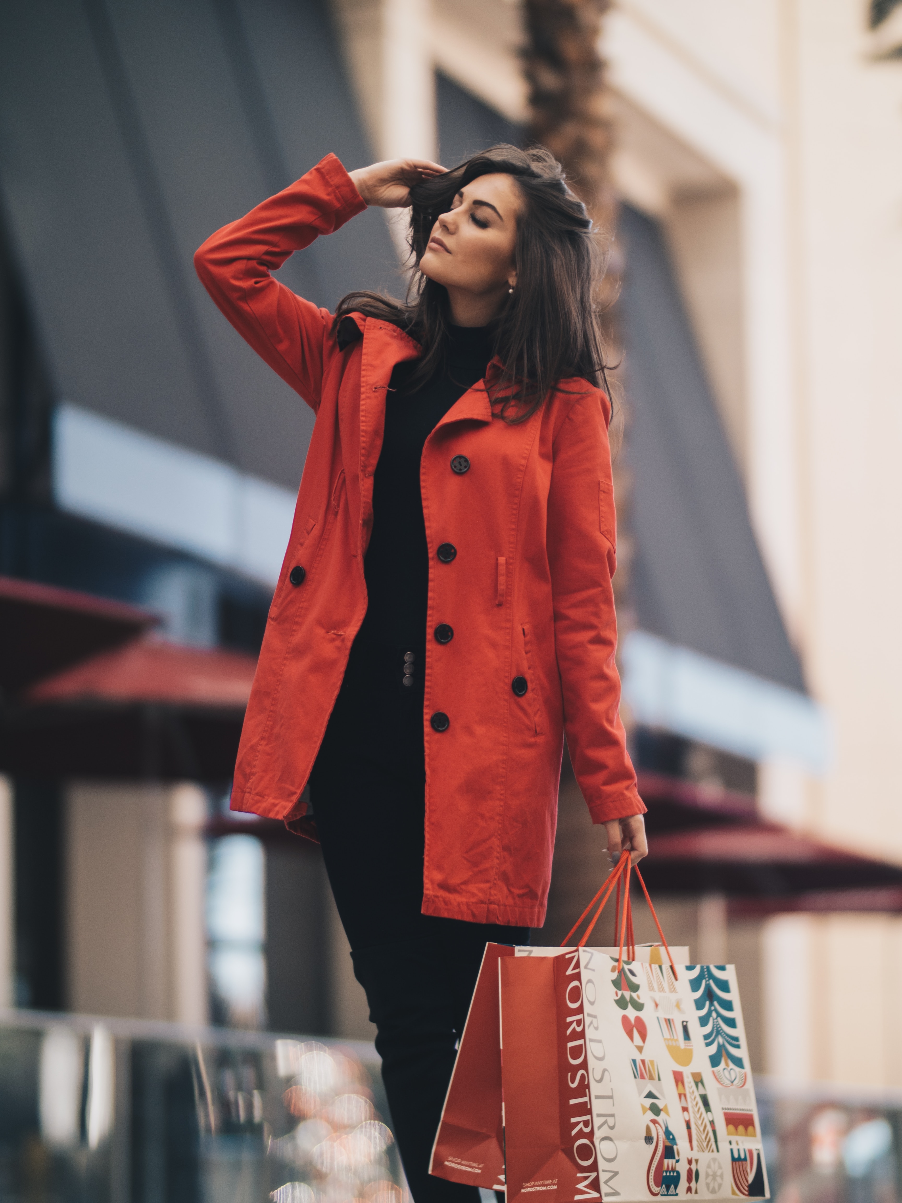 Women posing and modeling in red christmas tree